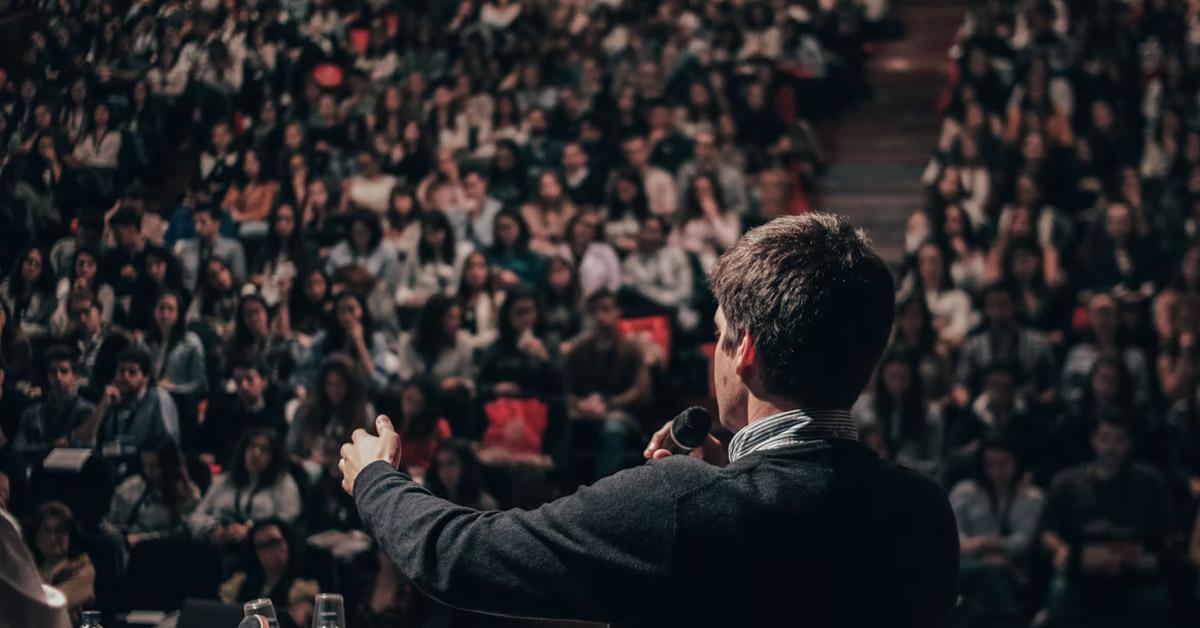 Man speaking to a crowd
